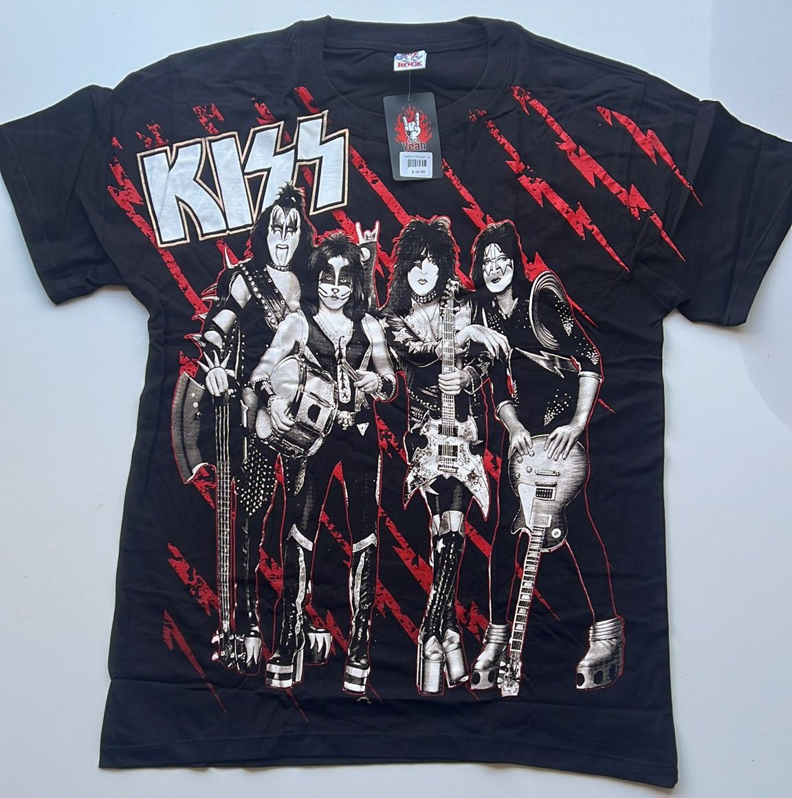 Kiss 1973 New York band shirt featuring classic band members with red lightning bolt design