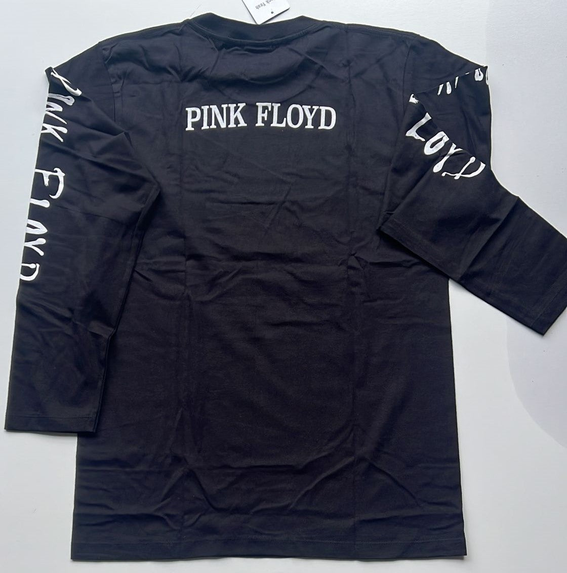 Black long sleeve shirt with Pink Floyd text featuring Pink Floyd Dark Side of the Moon album design