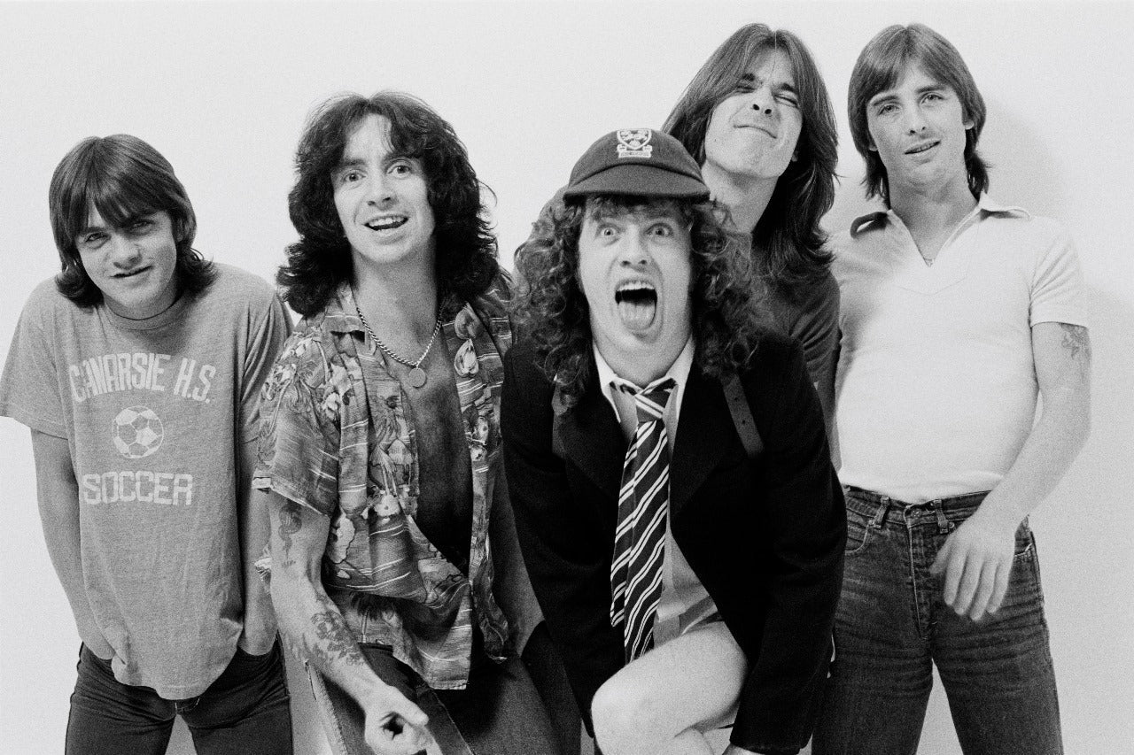 Classic black and white photo of AC DC band members promoting AC DC t shirts for sale