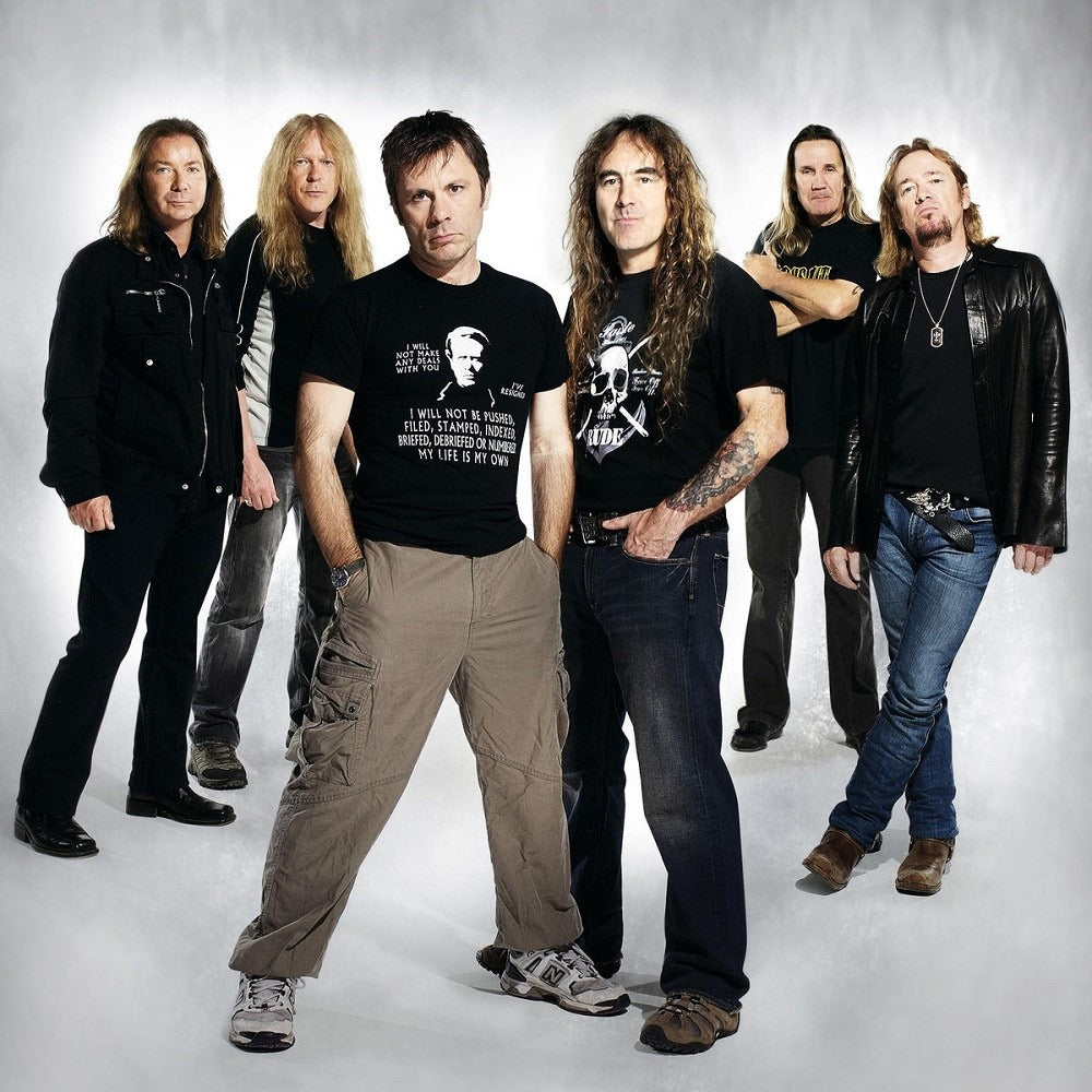 Iron Maiden band members wearing casual clothes including Iron Maiden band shirts in a studio photo