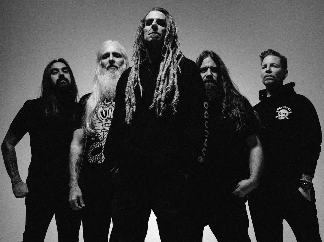 Lamb of God band members posing in black apparel showcasing Lamb Of God t-shirts for sale