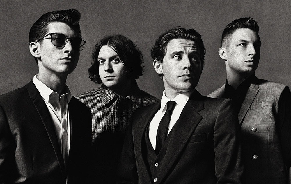Black and white photo of Arctic Monkeys band members promoting Arctic Monkeys t-shirts for sale
